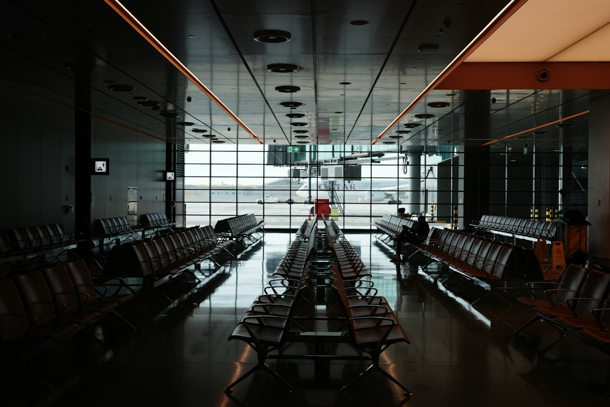 Travelers navigating baggage claim